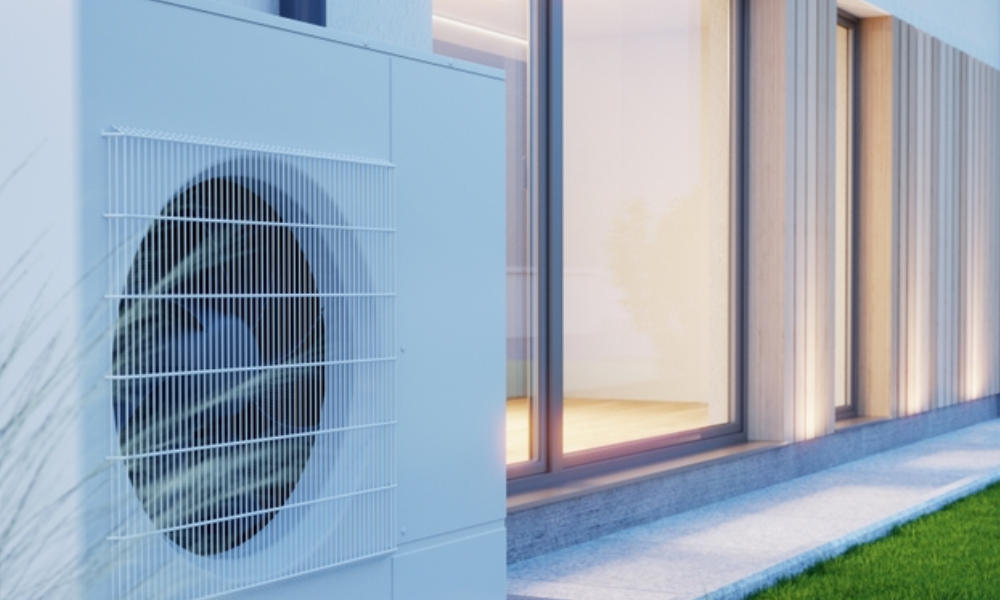 heat pump beside modern house with artificial grass