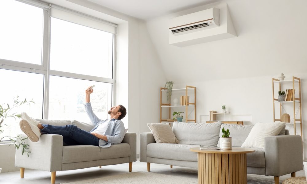 man lying enjoying his air conditioning